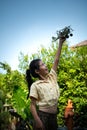 Portrait of a little girl in the front yard. with model aircraft which is the dream Royalty Free Stock Photo