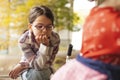 Portrait of a little girl with glasses in the autumn park Royalty Free Stock Photo