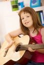 Portrait of little girl with guitar Royalty Free Stock Photo