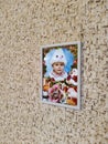 Portrait of little girl hanging on wall