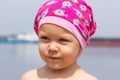 Portrait of little girl in hat on summer beach looking aside Royalty Free Stock Photo