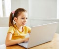 child laptop computer technology home girl education homework kid learning internet childhood student sitting connection Royalty Free Stock Photo