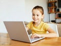 child laptop computer technology home girl education homework kid learning internet childhood student sitting connection Royalty Free Stock Photo