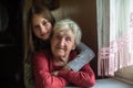 Portrait of little girl and her old great-grandmother. Family. Royalty Free Stock Photo