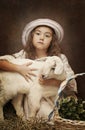 Portrait of a little girl with her pet goat Royalty Free Stock Photo