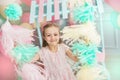 Portrait of a little girl holds a colorful garlands Royalty Free Stock Photo