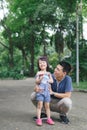 Portrait of little girl hugging her daddy with nature, family co Royalty Free Stock Photo