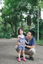 Portrait of little girl hugging her daddy with nature, family concept Royalty Free Stock Photo