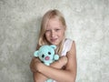 portrait of a little girl hugging her teddy bear Royalty Free Stock Photo