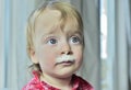 Portrait of a little girl with milk moustaches. Royalty Free Stock Photo