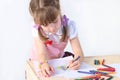 Portrait of little girl paint on paper sheets Royalty Free Stock Photo