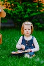 Portrait of little girl painting, summer outdoor Royalty Free Stock Photo