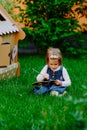 Portrait of little girl painting, summer outdoor Royalty Free Stock Photo