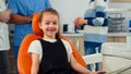 Portrait of little girl patient looking at camera waiting for pediatric stomatologist