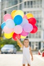 Portrait of little girl playing with air balloons Royalty Free Stock Photo
