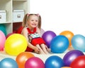 Portrait of a little girl playing with balls