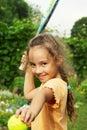 Portrait of little girl playing tennis outdoors Royalty Free Stock Photo