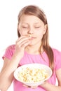 Portrait of a little girl with popcorn on white Royalty Free Stock Photo