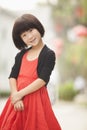 Portrait of Little Girl with Red Dress in Nanluoguxiang, Beijing, China