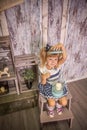 Portrait of little girl in retro vintage photographic studios