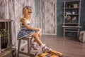 Portrait of little girl in retro vintage photographic studios