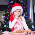 Portrait of little girl with rolling pin baking Royalty Free Stock Photo