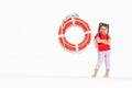 Portrait of little girl sea theme, little girl and lifebuoy Royalty Free Stock Photo