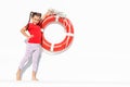 Portrait of little girl sea theme, little girl and lifebuoy Royalty Free Stock Photo