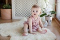 Portrait of a little girl sitting on the floor Royalty Free Stock Photo