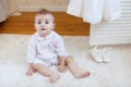 Portrait of a little girl sitting on the floor Royalty Free Stock Photo
