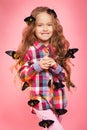 Portrait of a little girl with tropical butterflies. Royalty Free Stock Photo