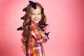 Portrait of a little girl with tropical butterflies. Royalty Free Stock Photo