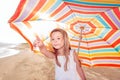 Portrait of a little girl with an umbrella on the beach Royalty Free Stock Photo