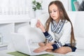 Portrait of little girl using modern laptop Royalty Free Stock Photo