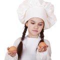 Portrait of a little girl in a white apron holding two chicken e Royalty Free Stock Photo