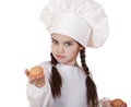 Portrait of a little girl in a white apron holding two chicken e Royalty Free Stock Photo