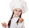 Portrait of a little girl in a white apron holding two chicken e Royalty Free Stock Photo