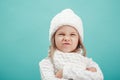 Portrait of a little girl in white hat and scarf Royalty Free Stock Photo