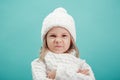 Portrait of a little girl in white hat and scarf Royalty Free Stock Photo