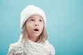 Portrait of a little girl in white hat and scarf Royalty Free Stock Photo