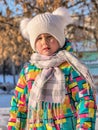 Portrait of a little girl in winter clothes