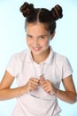 Portrait of a little girl 12 years old in a white blouse is smiling and happy Royalty Free Stock Photo