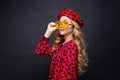 Portrait little girl in yellow glasses in red dress with hearts and red beret Royalty Free Stock Photo