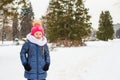 Portrait of little happy girl in the snow sunny Royalty Free Stock Photo
