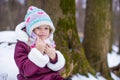 Portrait of little happy girl in the snow sunny Royalty Free Stock Photo