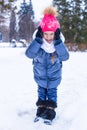 Portrait of little happy girl in the snow sunny Royalty Free Stock Photo