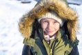 Portrait of little happy girl in snow sunny winter Royalty Free Stock Photo