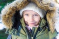 Portrait of little happy girl in snow sunny winter Royalty Free Stock Photo