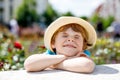 Portrait of little kid boy in hat in summer. Happy child. Royalty Free Stock Photo