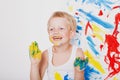 Portrait of a little messy kid painter. School. Preschool. Education. Creativity. Studio portrait over white background Royalty Free Stock Photo